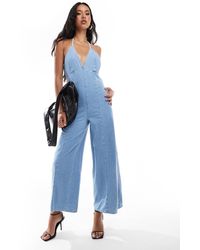 River Island - Denim Jumpsuit Met Halternek - Lyst