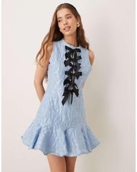 Sister Jane - Vestito Corto Polvere Con Fondo A Volant E Fiocchi A Contrasto - Lyst