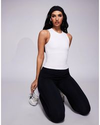 4505 - Icon High Neck Tank With Inner Bra - Lyst