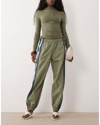 Lioness - Aniston Side Stripe Detail Nylon Windbreaker Trousers - Lyst