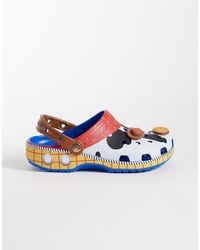 Crocs™ - Unisex Disney Toy Story Woody Classic Clogs-blue - Lyst