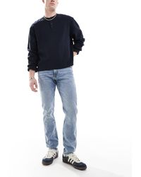 Calvin Klein - Vaqueros Tapered De Corte Slim Con Lavado Claro De -Azul - Lyst