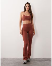 4505 - Icon Light Support Sports Bra With Adjustable Straps - Lyst