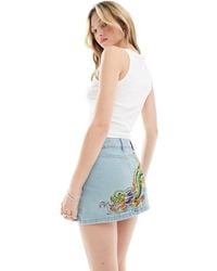 Ed Hardy - Tight Fit Micro Denim Mini Skirt With Blue Embroidery And Dragon Bum - Lyst