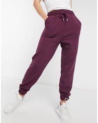 Pantalones de chándal y joggers Morado de mujer | Lyst