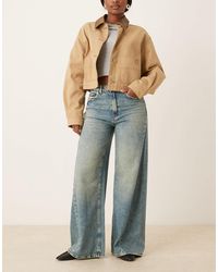 Jdy - – carina – jeans mit weitem bein, asymmetrischen nähten und mitteler waschung - Lyst