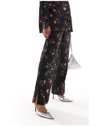 AllSaints - Pantalones s con estampado floral louisa tanana - Lyst