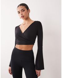4505 - Ballet Inspired Flared Sleeves Wrap Top - Lyst