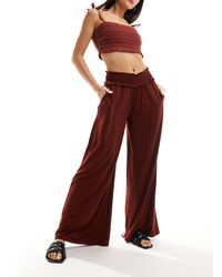 ASOS - Pantaloni a fondo ampio color ruggine con vita arricciata - Lyst