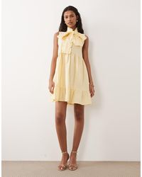Sister Jane - Buttermilk Cotton Blend Bow Detail Sleeveless Mini Dress - Lyst