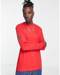 Nike - T-shirt à manches longues avec logo imprimé au dos - flamboyant - Lyst