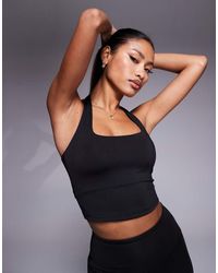 4505 - Canotta Tecnica Allacciata Al Collo Nera Con Reggiseno Interno - Lyst