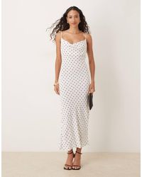 Mango - Robe mi-longue à col bénitier et pois - et blanc - Lyst