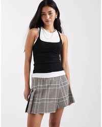 River Island - Checked Pleated Skort - Lyst