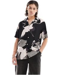 AllSaints - Zikano - camicia a maniche corte con grafica nera e bianca - Lyst
