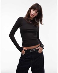 Tommy Hilfiger - T-Shirt Slim Nera A Maniche Lunghe Con Stemma - Lyst
