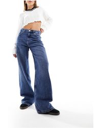 Pull&Bear - Jeans a fondo ampio scuro a vita medio alta - Lyst