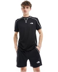 The North Face - Training hakuun - t-shirt nera con cuciture a contrasto - Lyst