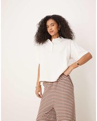 ASOS - Boxy Oversized Polo Top With Shoulder Pad - Lyst