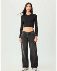 Stradivarius - – baggy-jeans aus schwarzem denim - Lyst