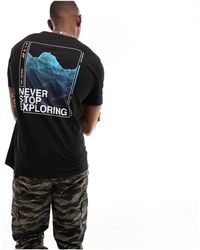 The North Face - Foundation - t-shirt nera con grafica sul retro - Lyst