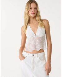 Stradivarius - Top Allacciato Al Collo Color Écru Con Paillettes Ricamate - Lyst