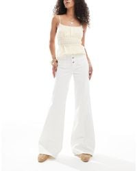 Miss Selfridge - Patch Pocket High Waist 70s Denim Flare Jeans - Lyst