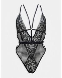 Ann Summers - Obsession Lace And Fishnet Plunge Front Crotchless Bodysuit With Strapping Detail - Lyst