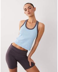 4505 - Seamless Lightweight Rib Racer Singlet With Contrast Binding - Lyst