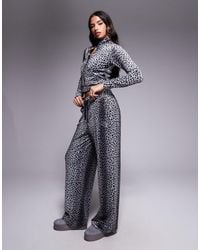 Juicy Couture - X asos – exklusive jogginghose mit farblich abgestimmtem schwarzem gepardenmuster, kombiteil - Lyst