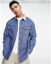 Giacca di jeans con stampa di Topolino e pile borg lavaggio chiaroLevi's in  Denim da Uomo colore Blu | Lyst