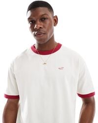 Hollister - T-shirt coupe carrée avec logo emblématique et passepoils contrastants - crème - Lyst