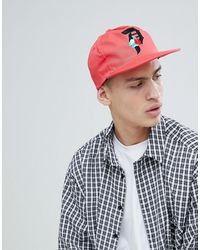 Primitive Cappellino snapback corallo con logo a rosa - Arancione