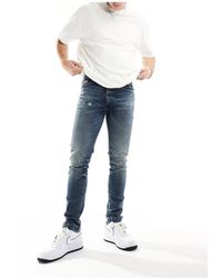 ASOS - Skinny Jeans With Abrasions - Lyst