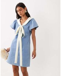 Sister Jane - Kasos Cotton Denim Bow Detail Short Sleeve Mini Dress - Lyst