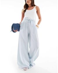 Stradivarius - Pantaloni A Fondo Ampio Con Vita Alta A Pieghe - Lyst