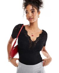 Morgan - Body Met V-Hals En Kanten Mouwen - Lyst