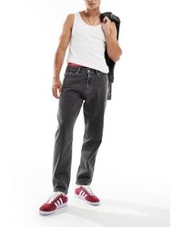Tommy Hilfiger - Vaqueros Negros De Corte Tapered Holgado Isaac De - Lyst