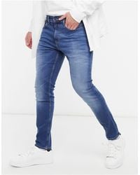 Tommy Hilfiger Jeans mit Tapered-Fit für Herren - Bis 51% Rabatt auf Lyst.de
