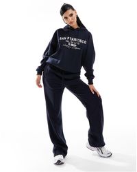 In The Style - X Perrie Sian Wide Leg Trackie Bottoms - Lyst