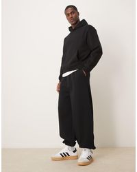 ASOS - Joggers Negros De Corte Globo Con Cinturilla De Vestir De - Lyst