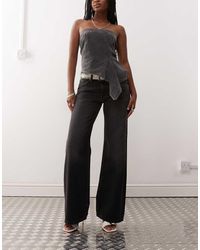 Weekday - Vaqueros Negro Lavado De Talle Bajo Y Pernera Ancha Imoo De - Lyst