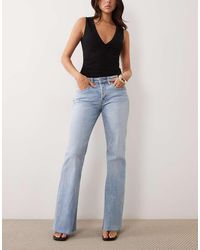GOOD AMERICAN - Vintage Low Waist Relaxed Flare Leg Jean - Lyst