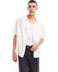 Weekday - Camicia a maniche corte vestibilità comoda bianca - Lyst