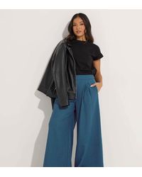 PixieGirl - Petite Pleated Palazzo Trousers - Lyst
