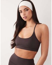 4505 - Icon Light Support Sports Bra With Adjustable Straps - Lyst
