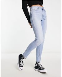 ONLY - Sh - jeans skinny azzurri con fondo sfrangiato - Lyst
