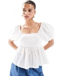 New Look - Top à manches bouffantes avec ourlet à basque et broderies pâquerettes - Lyst