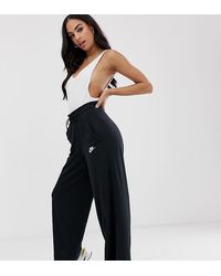 Nike Pantalon oversize évasé à taille haute - Noir