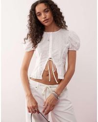 Lioness - Broderie Puff Sleeve Button Down Tie Detail Cropped Top - Lyst